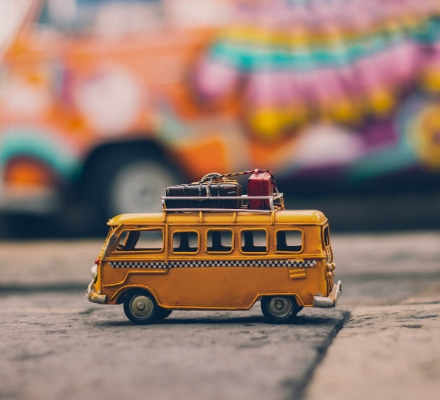 A photo of a small traveling bus toy to indicate that AGF's church insurance programs work for mission trips